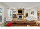 Bright living room features a fireplace, wooden accents, and comfortable seating at 504 Marsh Cove Cir, Summerville, SC 29486