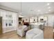 Open concept living room with fireplace and ample seating, with a view to the kitchen at 504 Marsh Cove Cir, Summerville, SC 29486