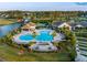 Aerial view of resort-style community pool with lounge chairs and covered seating areas at 504 Marsh Cove Cir, Summerville, SC 29486