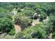Expansive wooded acreage featuring mature trees and a winding private driveway to the home at 5126 Highway 174, Hollywood, SC 29449
