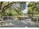 Inviting backyard deck with grilling area overlooking a spacious yard and picturesque landscaping at 5126 Highway 174, Hollywood, SC 29449