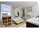 Bathroom with clawfoot tub, unique mermaid decor, and modern vanity with ample counter space at 5126 Highway 174, Hollywood, SC 29449