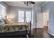 Bright bedroom featuring hardwood floors, lots of natural light and neutral paint at 5126 Highway 174, Hollywood, SC 29449