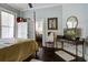 Bedroom with hardwood floors, writing desk, and cozy ambiance at 5126 Highway 174, Hollywood, SC 29449