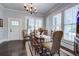 Bright dining room features hardwood floors and natural light from the large windows at 5126 Highway 174, Hollywood, SC 29449