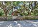 Charming home with mature trees and fenced yard, offering privacy and curb appeal at 5126 Highway 174, Hollywood, SC 29449