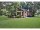 Charming home with mature tree, inviting porch and a beautifully maintained lawn at 5126 Highway 174, Hollywood, SC 29449