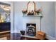 Elegant room featuring a charming fireplace, hardwood floors, and decorative accents at 5126 Highway 174, Hollywood, SC 29449