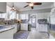 Bright kitchen featuring white cabinets, a mosaic backsplash, stainless steel appliances, and neutral paint at 5126 Highway 174, Hollywood, SC 29449