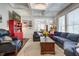 Spacious living room with hardwood floors, comfortable seating, and seamless dining area at 5126 Highway 174, Hollywood, SC 29449