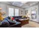 Spacious living room featuring a large sectional sofa, wooden coffee table, and hardwood floors at 5126 Highway 174, Hollywood, SC 29449