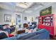 Cozy living room with coffered ceilings, chandelier, and comfortable blue sofas at 5126 Highway 174, Hollywood, SC 29449