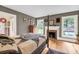 Bedroom featuring hardwood floors, fireplace and views of the yard at 516 Hope Plantation Ln, Jacksonboro, SC 29452