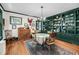 Charming dining room with custom built-in shelving and hardwood flooring at 516 Hope Plantation Ln, Jacksonboro, SC 29452
