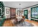 Inviting dining room featuring hardwood floors and a view to the outdoors at 516 Hope Plantation Ln, Jacksonboro, SC 29452