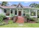 Charming house with red brick steps and a delightful front porch at 516 Hope Plantation Ln, Jacksonboro, SC 29452