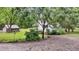 Charming home with gravel driveway, lush trees, shed, and well-maintained yard at 516 Hope Plantation Ln, Jacksonboro, SC 29452