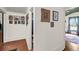 Hallway with hardwood floors and decorative wall art at 516 Hope Plantation Ln, Jacksonboro, SC 29452
