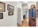 Hallway with hardwood floors and a red cabinet at 516 Hope Plantation Ln, Jacksonboro, SC 29452