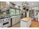 Well-equipped kitchen with stainless steel appliances and a central island at 516 Hope Plantation Ln, Jacksonboro, SC 29452