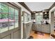 Cozy kitchenette with built-in shelving and natural light at 516 Hope Plantation Ln, Jacksonboro, SC 29452