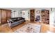 Inviting living room with wood floors, comfortable leather furniture, and open layout at 516 Hope Plantation Ln, Jacksonboro, SC 29452