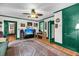 Bright living room with hardwood floors, ceiling fan, a TV, and vintage decor at 516 Hope Plantation Ln, Jacksonboro, SC 29452