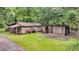 Rustic outbuildings provide character and potential storage or workshop space at 516 Hope Plantation Ln, Jacksonboro, SC 29452
