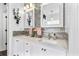 Stylish bathroom features double vanity with gray tile backsplash and modern lighting at 555 Pointe Of Oaks Rd, Summerville, SC 29485