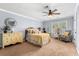 Bedroom with a window, carpet, yellow bedding and furnishings at 555 Pointe Of Oaks Rd, Summerville, SC 29485