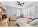 This bedroom features large windows with plantation shutters, and space for decorative play furniture at 555 Pointe Of Oaks Rd, Summerville, SC 29485