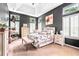 Spacious bedroom featuring high ceilings, plantation shutters, and stylish decor at 555 Pointe Of Oaks Rd, Summerville, SC 29485