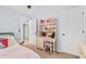 A bedroom showcases a classic decor with a desk and display shelves, creating a cozy and organized space at 555 Pointe Of Oaks Rd, Summerville, SC 29485