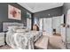 Primary bedroom features a sitting area, lots of windows, and adjoins the en suite bath at 555 Pointe Of Oaks Rd, Summerville, SC 29485
