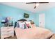 Comfortable bedroom features pastel blue walls, decorative pillows and a ceiling fan for a relaxing atmosphere at 555 Pointe Of Oaks Rd, Summerville, SC 29485