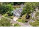 Charming two-story home with manicured lawn, mature trees, and driveway. Vehicles parked in driveway at 555 Pointe Of Oaks Rd, Summerville, SC 29485