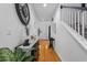 Welcoming foyer with hardwood floors, stylish decor, staircase, and view of the front door at 555 Pointe Of Oaks Rd, Summerville, SC 29485