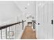 Upstairs hallway with carpet leading to the stairs and bedrooms in the home at 555 Pointe Of Oaks Rd, Summerville, SC 29485
