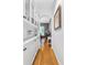 Hallway featuring hardwood floors, wainscoting, archway, and built in cabinets at 555 Pointe Of Oaks Rd, Summerville, SC 29485