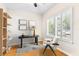 Bright home office with a minimalist desk, chair, and natural light, perfect for productivity and focus at 555 Pointe Of Oaks Rd, Summerville, SC 29485