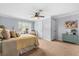 Carpeted primary bedroom with a queen sized bed, window with blinds and a side table at 555 Pointe Of Oaks Rd, Summerville, SC 29485