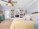 Bedroom with a built in shelf, carpet and yellow bed spread at 555 Pointe Of Oaks Rd, Summerville, SC 29485