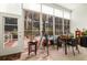 Enclosed patio featuring large windows overlooking the pool and lush greenery, ideal for relaxation and dining at 555 Pointe Of Oaks Rd, Summerville, SC 29485
