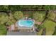 Aerial view of backyard oasis, showcasing the private pool, lush landscaping, and outdoor lounging space at 555 Pointe Of Oaks Rd, Summerville, SC 29485