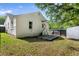 View of the home's backyard featuring a patio with hammock and access to the back door at 5814 Knight St, Hanahan, SC 29410