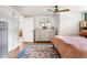 A cozy bedroom featuring a dresser, hardwood floors, and an eye-catching patterned rug at 5814 Knight St, Hanahan, SC 29410