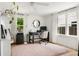 Bright office space featuring natural light, a modern desk, and minimalist decor at 5814 Knight St, Hanahan, SC 29410