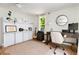A bright office space features natural light, stylish decor, and a comfortable workspace at 5814 Knight St, Hanahan, SC 29410