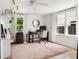 Bright office space featuring natural light, a modern desk, and minimalist decor at 5814 Knight St, Hanahan, SC 29410