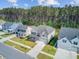 Aerial view of homes in a suburban neighborhood, featuring well-maintained lawns and tree-lined streets at 596 Dunswell Dr, Summerville, SC 29486